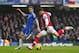 LONDON, ENGLAND - JANUARY 20: Olivier Giroud of Arsenal shoots past Gary Cahill of Chelsea during the Barclays Premier League match between Chelsea and Arsenal at Stamford Bridge on January 20, 2013 in London, England. (Photo by Clive Rose/Getty Images)