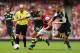 LONDON, ENGLAND - SEPTEMBER 22: Jack Wilshere of Arsenal goes between Jonathan Walters (19) and Geoff Cameron of Stoke City (20) during the Barclays Premier League match between Arsenal and Stoke City at Emirates Stadium on September 22, 2013 in London,
