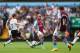 BIRMINGHAM, ENGLAND - AUGUST 24: Karim El Ahmadi (C) of Aston threads a ball past Lucas (L) of Liverpool during the Barclays Premier League match between Aston Villa and Liverpool at Villa Park on August 24, 2013 in Birmingham, England. (Photo by Michae