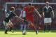 LIVERPOOL, ENGLAND - SEPTEMBER 21: Steven Gerrard of Liverpool moves away from Adam Lallana of Southampton during the Barclays Premier League match between Liverpool and Southampton at Anfield on September 21, 2013 in Liverpool, England. (Photo by Clive