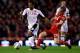 LIVERPOOL, ENGLAND - MAY 01: Mousa Dembele of Fulham is challenged by Jay Spearing of Liverpool during the Barclays Premier League match between Liverpool and Fulham at Anfield on May 1, 2012 in Liverpool, England. (Photo by Clive Brunskill/Getty Images