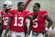 September 8, 2012; Columbus, OH, USA; Ohio State Buckeyes quarterback Kenny Guiton (13) talks with quarterback Braxton Miller (5) before their game against the UCF Knights at Ohio Stadium. Mandatory Credit: Greg Bartram-USA TODAY Sports