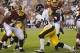 Aug 19, 2013; Landover, MD, USA; Pittsburgh Steelers running back Le'Veon Bell (26) runs the ball against the Washington Redskins in the first half at FedEx Field. Mandatory Credit: Geoff Burke-USA TODAY Sports