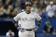 TORONTO, CANADA - SEPTEMBER 18: Robinson Cano #24 of the New York Yankees reacts after his groundball just stayed fair resulting in a groundout in the sixth inning during MLB game action against the Toronto Blue Jays on September 18, 2013 at Rogers Centre