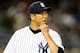 NEW YORK, NY - SEPTEMBER 24: Hiroki Kuroda #18 of the New York Yankees walks off the field after the first inning against the Tampa Bay Rays on September 24, 2013 at Yankee Stadium in the Bronx borough of New York City. (Photo by Elsa/Getty Images)