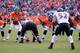DENVER, CO - JANUARY 12: Peyton Manning #18 of the Denver Broncos calls signals out in the shotgun formation behind the linne of scrimmage against Ray Lewis #52 of the Baltimore Ravens during the AFC Divisional Playoff Game at Sports Authority Field at M