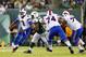 EAST RUTHERFORD, NJ - SEPTEMBER 22: Quarterback EJ Manuel #3 of the Buffalo Bills looks to pass with blocking help from teammates center Colin Brown #74 and offensive tackle Cordy Glenn #77 on defensive end Quinton Coples #98 of the New York Jets during a