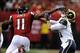 Sep 15, 2013; Atlanta, GA, USA; Atlanta Falcons wide receiver Julio Jones (11) straight arms St. Louis Rams cornerback Cortland Finnegan (31) during the second half at Georgia Dome. The Falcons defeated the Rams 31-24. Mandatory Credit: Dale Zanine-USA TO