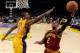 Jan 13, 2012; Los Angeles, CA, USA; Los Angeles Lakers center Andrew Bynum (17) defends a shot by Cleveland Cavaliers point guard Kyrie Irving (2) during the second half of the game at the Staples Center. 97-92. Lakers won Mandatory Credit: Jayne Kamin-O