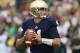 SOUTH BEND, IN - SEPTEMBER 21: Tommy Rees #11 of the Notre Dame Fighting Irish looks for a receiver against the Michigan State Spartans at Notre Dame Stadium on September 21, 2013 in South Bend, Indiana. Notre dame defeated Michigan State 17-13. (Photo