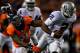 DENVER, CO - SEPTEMBER 23: Defensive end Robert Ayers #91 of the Denver Broncos forces quarterback Terrelle Pryor #2 of the Oakland Raiders out of the pocket during the third quarter at Sports Authority Field Field at Mile High on September 23, 2013 in D