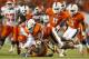 MIAMI GARDENS, FL - SEPTEMBER 21: Luther Robinson #93 of the Miami Hurricanes tackles Jordan Jackson #34 of the Savannah State Tigers on September 21, 2013 at Sun Life Stadium in Miami Gardens, Florida. Miami defeated Savannah State 77-7. (Photo by Joel A