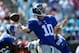 CHARLOTTE, NC - SEPTEMBER 22: Eli Manning #10 of the New York Giants drops back to pass against the Carolina Panthers during their game at Bank of America Stadium on September 22, 2013 in Charlotte, North Carolina. (Photo by Streeter Lecka/Getty Images