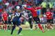 CARDIFF, WALES - SEPTEMBER 22: Fraizer Campbell (R) of Cardiff City is aerial as Michael Dawson (L) of Tottenham Hotspur prepares to clear the ball during the Barclays Premier League match between Cardiff City and Tottenham Hotspur at Cardiff City Stadiu