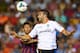 VALENCIA, SPAIN - SEPTEMBER 01: Neymar (L) of Barcelona competes for the ball with Adil Rami of Valencia during the La Liga match between Valencia CF and FC Barcelona at Estadio Mestalla on September 1, 2013 in Valencia, Spain. (Photo by Manuel Queimade