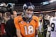 Sep 23, 2013; Denver, CO, USA; Denver Broncos quarterback Peyton Manning (18) walks off the field after the game against the Oakland Raiders at Sports Authority Field at Mile High. The Broncos defeated the Raiders 37-21. Mandatory Credit: Kirby Lee-USA T