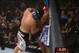 Nick Diaz presses Paul Daley into the fence. He gives Daley his neck while landing punches underneath Daley's elbows.