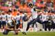 DENVER, CO - AUGUST 24: Place kicker Greg Zuerlein #4 of the St. Louis Rams kicks a field goal attempt on a hold by punter Johnny Hekker #6 against the Denver Broncos at Sports Authority Field at Mile High on August 24, 2013 in Denver, Colorado. (Photo by