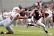 HOUSTON, TX- SEPTEMBER 21: Johnny Manziel #2 of the Texas A&M Aggies rushes past Zach Wood #90 of the Southern Methodist Mustangs in the first half on September 21, 2013 at Kyle Field in College Station, Texas. (Photo by Thomas B. Shea/Getty Images)