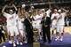 INDIANAPOLIS - MARCH 16: Big Ten Commissioner Jim Delany presents head coach Bo Ryan and the players from the Wisconsin Badgers with the Big Ten Tournament Championship trophy after their 61-48 win against the Illinois Fighting Illini during the Champion