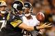 PITTSBURGH, PA - SEPTEMBER 22: Ben Roethlisberger #7 of the Pittsburgh Steelers recovers his own fumble while trying to outrun the tackle of Corey Wootton #98 of the Chicago Bears during the third quarter at Heinz Field on September 22, 2013 in Pittsburg