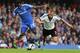 LONDON, ENGLAND - SEPTEMBER 21: Samuel Eto'o of Chelsea tracks back to put a tackle in on Fulham's Steve Sidwell during the Barclays Premier League match between Chelsea and Fulham at Stamford Bridge on September 21, 2013 in London, England. (Photo by Cha