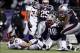 Jan 14, 2012; Foxborough, MA, USA; Denver Broncos quarterback Tim Tebow (15) is sacked by New England Patriots defensive tackle Gerard Warren (98) in the first half of the 2011 AFC divisional playoff game at Gillette Stadium. Mandatory Credit: David Butle