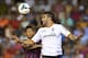 VALENCIA, SPAIN - SEPTEMBER 01: Neymar (L) of Barcelona competes for the ball with Adil Rami of Valencia during the La Liga match between Valencia CF and FC Barcelona at Estadio Mestalla on September 1, 2013 in Valencia, Spain. (Photo by Manuel Queimade