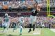 CLEVELAND, OH - SEPTEMBER 8: Line backer Philip Wheeler #52 and cornerback Brent Grimes #21 of the Miami Dolphins watch as tight end Jordan Cameron #84 of the Cleveland Browns catches a touchdown reception during the first half at First Energy Stadium on