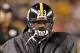 Sep 22, 2013; Pittsburgh, PA, USA; Pittsburgh Steelers running back Isaac Redman (33) tries to stay warm on the sidelines against the Chicago Bears during the third quarter at Heinz Field. The Bears won 40-23. Mandatory Credit: Charles LeClaire-USA TODAY