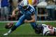HOUSTON, TX - SEPTEMBER 15: Jake Locker #10 of the Tennessee Titans is tackled by J.J. Watt #99 of the Houston Texans at Reliant Stadium on September 15, 2013 in Houston, Texas. (Photo by Scott Halleran/Getty Images)