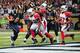 ST. LOUIS, MO - SEPTEMBER 8: Sam Bradford #8 of the St. Louis Rams scores on a two-point conversion against Jasper Brinkley #52 of the Arizona Cardinals at the Edward Jones Dome on September 8, 2013 in St. Louis, Missouri. (Photo by Michael Thomas/Getty