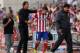 MADRID, SPAIN - SEPTEMBER 14: Head coach Diego Pablo Simeone (L) of Atletico de Madrid replaces David Villa (R) for Arda Turan during the La Liga match between Club Atletico de Madrid and UD Almeria at Vicente Calderon Stadium on September 14, 2013 in Mad