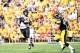 Aug 31, 2013; Iowa City, IA, USA; Northern Illinois Huskies quarterback Jordan Lynch (6) throws a pass against Iowa Hawkeyes linebacker James Morris (44) during the first quarter at Kinnick Stadium. Mandatory Credit: Mike DiNovo-USA TODAY Sports