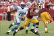 Sep 22, 2013; Landover, MD, USA; Washington Redskins quarterback Robert Griffin III (10) runs with the ball as Detroit Lions defensive end Willie Young (79) chases in the fourth quarter at FedEx Field. The Lions won 27-20. Mandatory Credit: Geoff Burke-US