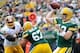 Sep 15, 2013; Green Bay, WI, USA; Green Bay Packers quarterback Aaron Rodgers grets a pass away in the fourth quarter during the game against the Washington Redskins at Lambeau Field. Mandatory Credit: Benny Sieu-USA TODAY Sports