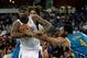 April 10, 2013; Sacramento, CA, USA; Sacramento Kings center DeMarcus Cousins (15) controls the rebound against New Orleans Hornets center Robin Lopez (15) and shooting guard Xavier Henry (4) during the fourth quarter at Sleep Train Arena. The Sacramento