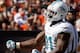 CLEVELAND, OH - SEPTEMBER 08: Defensive end Cameron Wake #91 of the Miami Dolphins celebrates after sacking quarterback Brandon Weeden #3 of the Cleveland Browns at Cleveland Browns Stadium on September 8, 2013 in Cleveland, Ohio. (Photo by Matt Sullivan/