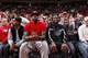 LeBron James and teammate Dwyane Wade attend an OSU basketball game.