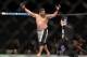 Apr 27, 2013; Newark, NJ, USA; Roy Nelson (white shorts) celebrates defeating Cheick Kongo (yellow and grey shorts) during UFC 159 at the Prudential Center. Mandatory Credit: Brad Penner-USA TODAY Sports