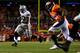 DENVER, CO - SEPTEMBER 23: Running back Darren McFadden #20 of the Oakland Raiders runs for a touchdown late in the fourth quarter as safety David Bruton #30 of the Denver Broncos gives chase at Sports Authority Field Field at Mile High on September 23,