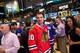NEW YORK, NY - SEPTEMBER 06: National Hockey League (NHL) player Patrick Sharp of the Chicago Blackhawks speaks with traders on the floor of the New York Stock Exchange (NYSE) after ringing the opening bell on September 6, 2013 in New York City. NHL is ce