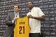 INDEPENDENCE, OH - JULY 19: Andrew Bynum holds up his new jersey as he is introduced as a new addition to the Cleveland Cavaliers alongside general manager Chris Grant at The Cleveland Clinic Courts on July 19, 2013 in Independence, Ohio in Cleveland, Oh