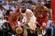 Feb 6 2013; Miami, FL, USA; Houston Rockets shooting guard James Harden (13) chases a loose ball as Miami Heat shooting guard Dwyane Wade (3) and Miami Heat point guard Mario Chalmers (15) both defend the play in the second half at American Airlines Aren