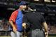 PHOENIX, AZ - JULY 23: Manager Dale Sveum #4 of the Chicago Cubs argues with home plate umpire Dana DeMuth after being thrown out of the third inning of the the MLB game against the Arizona Diamondbacks at Chase Field on July 23, 2013 in Phoenix, Arizona