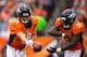 DENVER, CO - AUGUST 24: Quarterback Peyton Manning #18 of the Denver Broncos hands the ball off to running back Ronnie Hillman #21 against the St. Louis Rams at Sports Authority Field at Mile High on August 24, 2013 in Denver, Colorado. (Photo by Justin E