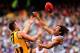 MELBOURNE, AUSTRALIA - SEPTEMBER 28: Tendai Mzungu of the Dockers spoils a mark by Brian Lake of the Hawks during the 2013 AFL Grand Final match between the Hawthorn Hawks and the Fremantle Dockers at Melbourne Cricket Ground on September 28, 2013 in Me