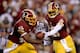 LANDOVER, MD - SEPTEMBER 09: Quarterback Robert Griffin III #10 of the Washington Redskins hands the ball off to running back Alfred Morris #46 before Morris fumbles in the first quarter against the Philadelphia Eagles at FedExField on September 9, 2013
