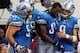 ARLINGTON, TX - OCTOBER 02: Gosder Cherilus #77 of the Detroit Lions (back), Dominic Raiola #51 of the Detroit Lions (2nd L) and Matthew Stafford #9 of the Detroit Lions (R) assist Calvin Johnson #81 of the Detroit Lions to the bench after scoring the ga
