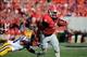 Sep 28, 2013; Athens, GA, USA; Georgia Bulldogs running back Keith Marshall (4) runs past LSU Tigers safety Micah Eugene (34) during the second quarter at Sanford Stadium. Mandatory Credit: Dale Zanine-USA TODAY Sports